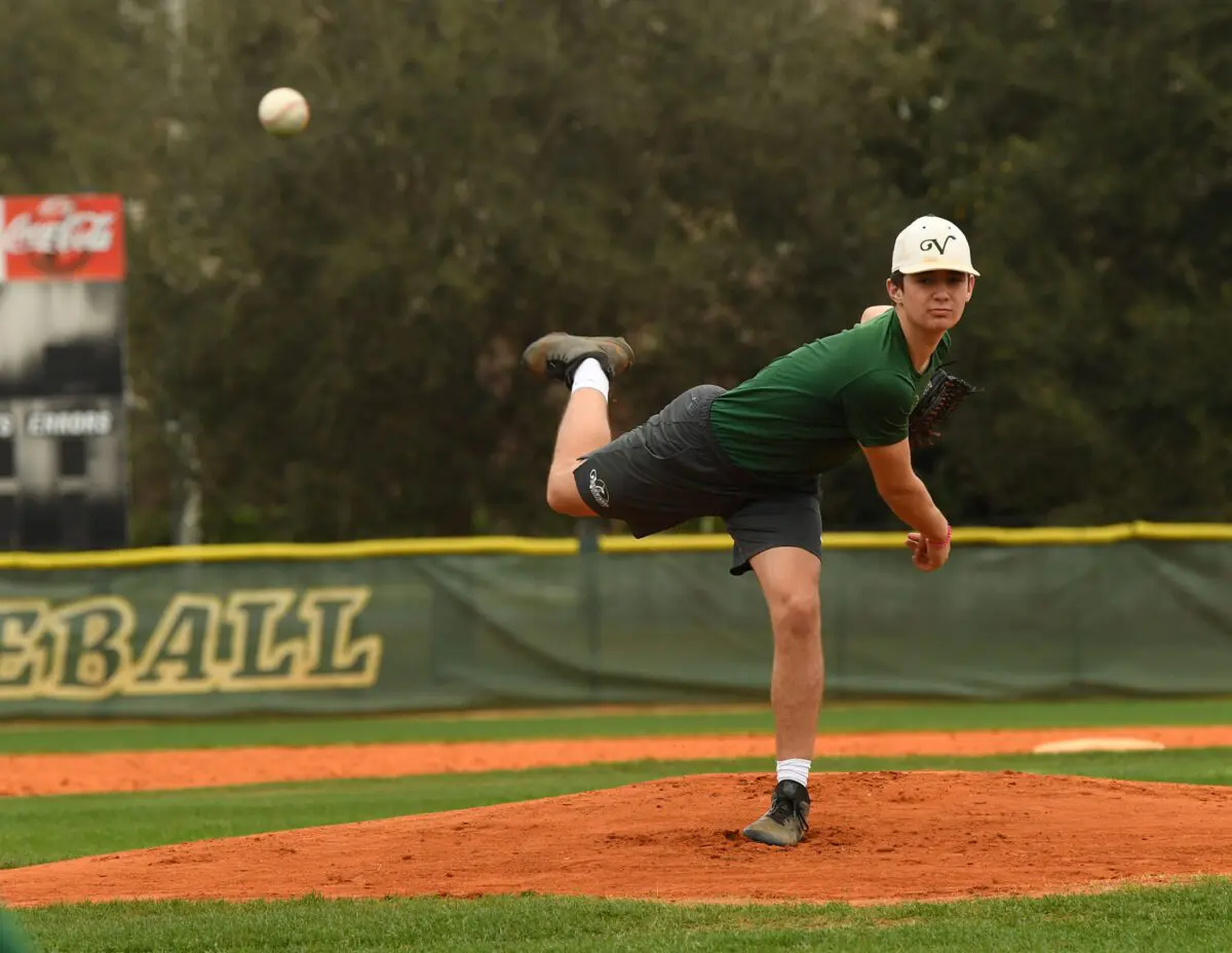 George Horsford / Daily Sun - Shawn Guilliams, {cq}, a twelfth grade member of The Villages High School baseball team, practices his pitching at The Villages High School baseball field on February 17, 2020.