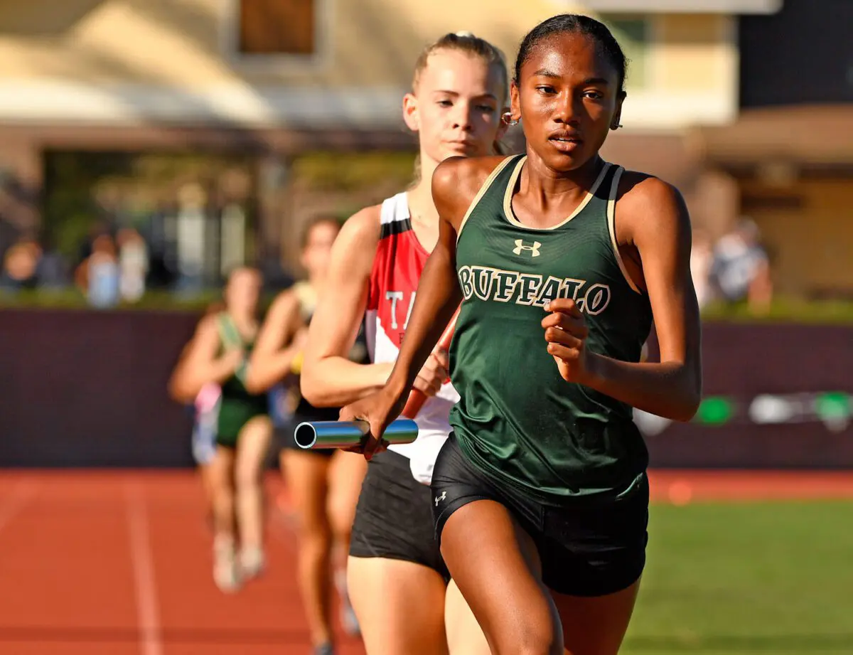 George Horsford / Daily Sun - Lia Byron, {cq}, an eleventh grade member of The Villages High School Track and Field team and the lead runner for the girls’ 4 x 800 meter relay team, takes the lead of the race during The Villages High School track meet on February 24, 2022.