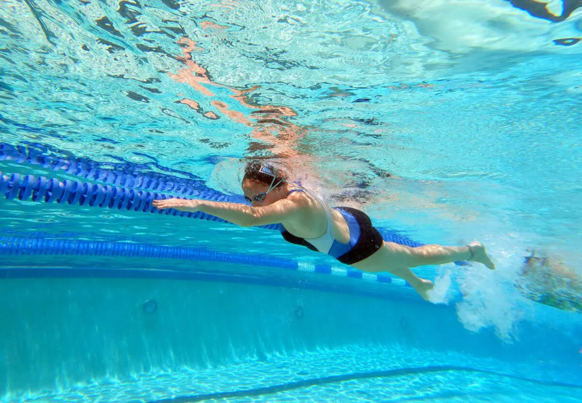 Bill Mitchell / Daily Sun  -  Meg Ireland of The Villages High School swims laps, Monday, July 26th, 2021, during conditioning drills at the Laurel Manor Regional Recreation Complex sports pool.