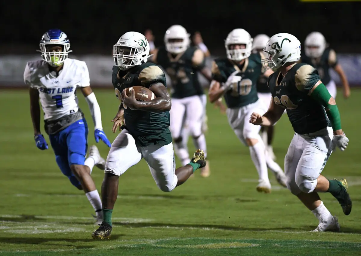 Bill Mitchell / Daily Sun  -  Ed Williams, (cq), (26), of The Villages High School rushes for a 50 yard touchdown during football action against East Lake High School, Friday, September 17th, 2021, at The H.G. Morse Range.