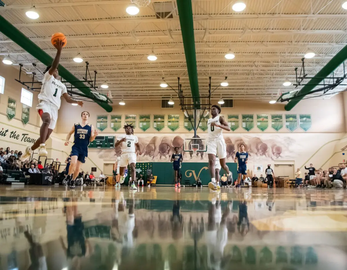 Michael Johnson / Daily Sun - Q'Zorian Kennedy{cq} (1), of the Villages High School{cq}, finishes the break away after the Concord Academy{cq} turnover in the first quarter of the day two game of the Battle at The Villages{cq} on Tuesday, Dec. 28, 2021 at the VHS Athletic Center. The Villages defeated Concord Academy 67-65.
