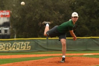 George Horsford / Daily Sun - Shawn Guilliams, {cq}, a twelfth grade member of The Villages High School baseball team, practices his pitching at The Villages High School baseball field on February 17, 2020.