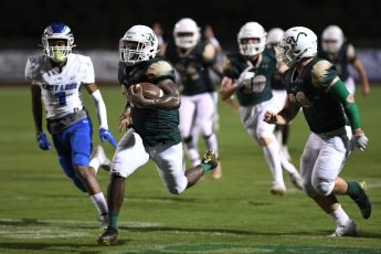 Bill Mitchell / Daily Sun - Ed Williams, (cq), (26), of The Villages High School rushes for a 50 yard touchdown during football action against East Lake High School, Friday, September 17th, 2021, at The H.G. Morse Range.
