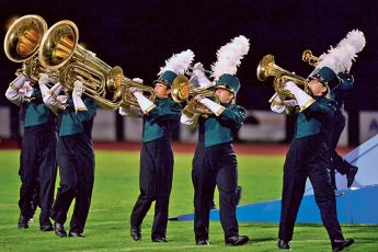 George Horsford / Daily Sun - The members of The Villages High School Marching Buffalo Band play their instruments as they march across the football field during their halftime performance of "Above the Clouds" during the football game against Interlachen on October 13, 2017.